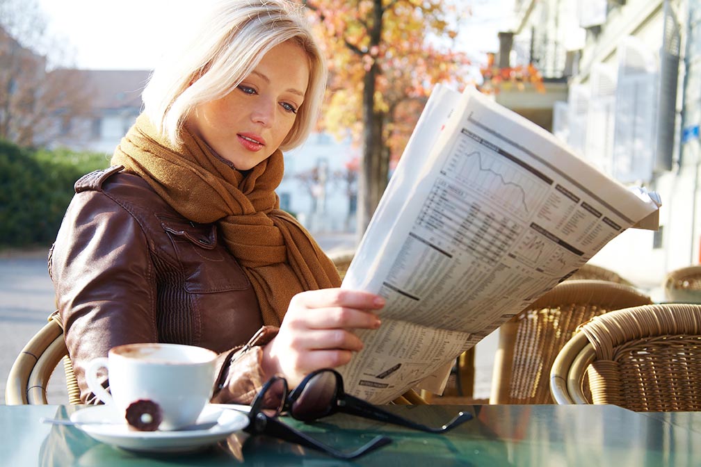 How To Get Free Publicity Woman Reading Newspaper